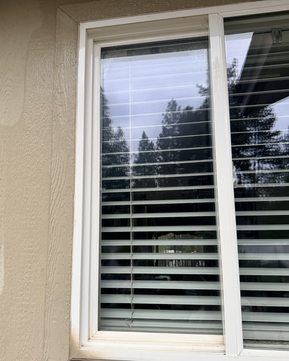 Window frame after cleaning, spotless white frame and sill